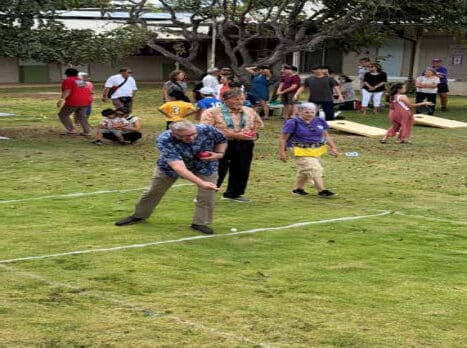 Danny Topp throws the Pallino ball (white) to start the game followed by the Bocce ball