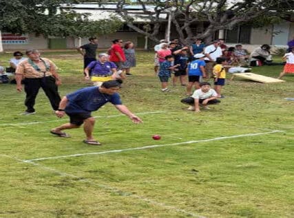 Ed Tamori tries to throw the Bocce ball as closest to the Pallino as he can